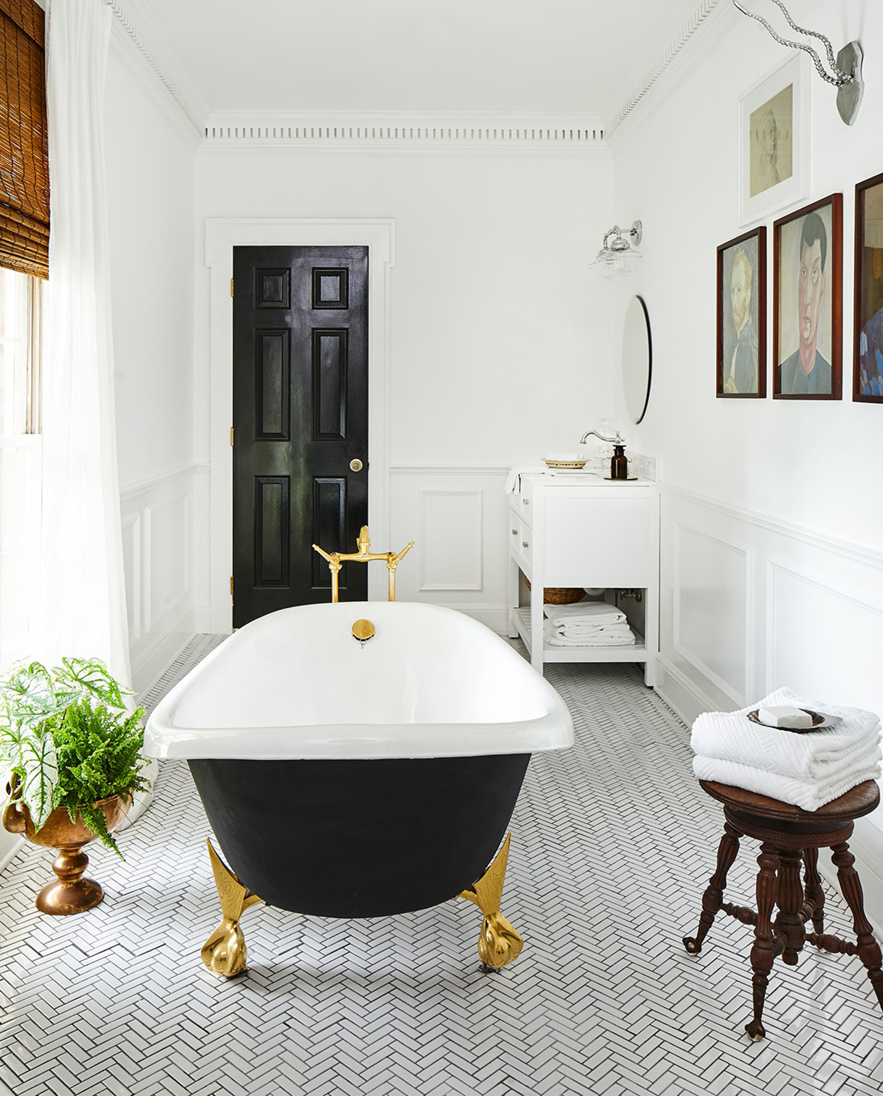 remodeled black and white bathroom clawfoot tub
